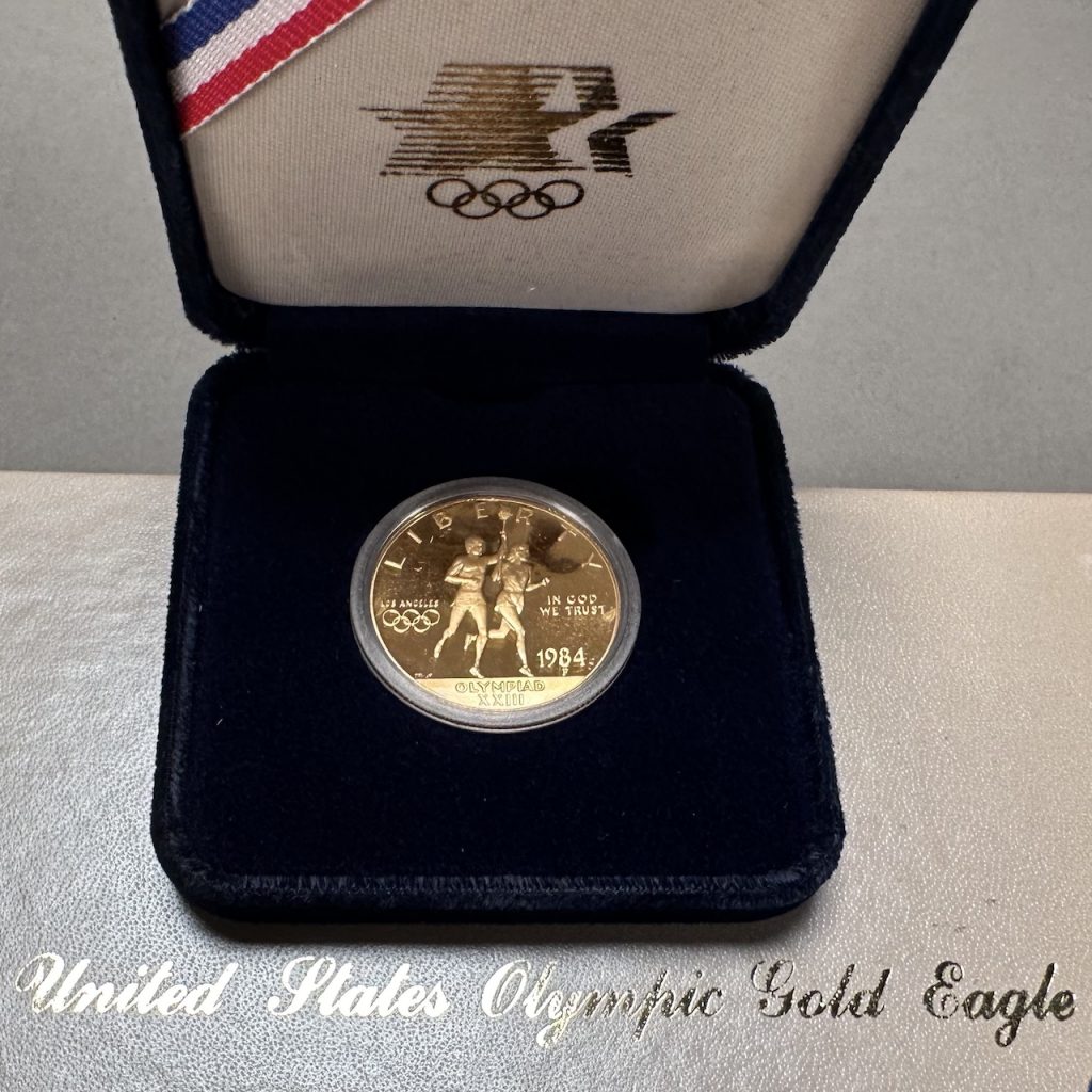 LOT 004 GOLD COIN 1984 OLYMPIC LIBERTY 10 DOLLAR GOLD COIN IN CASE lot-004-gold-coin-1984-olympic-liberty-10-dollar-gold-coin-in-case